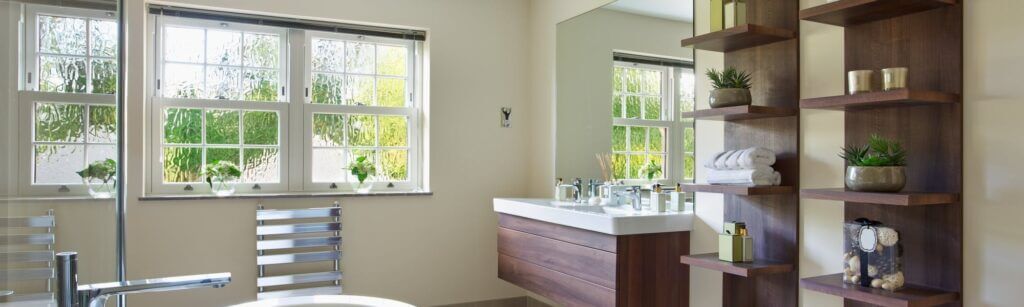 Large bathroom with installed wall radiator and bathroom sink base units furniture