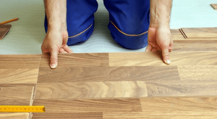 tradesman fitting wood flooring